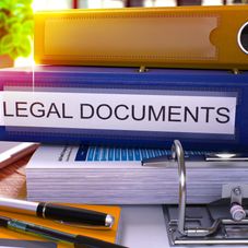 Blue Office Folder with Inscription Legal Documents on Office Desktop 