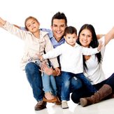 Happy family smiling with arms up - isolated over a white background